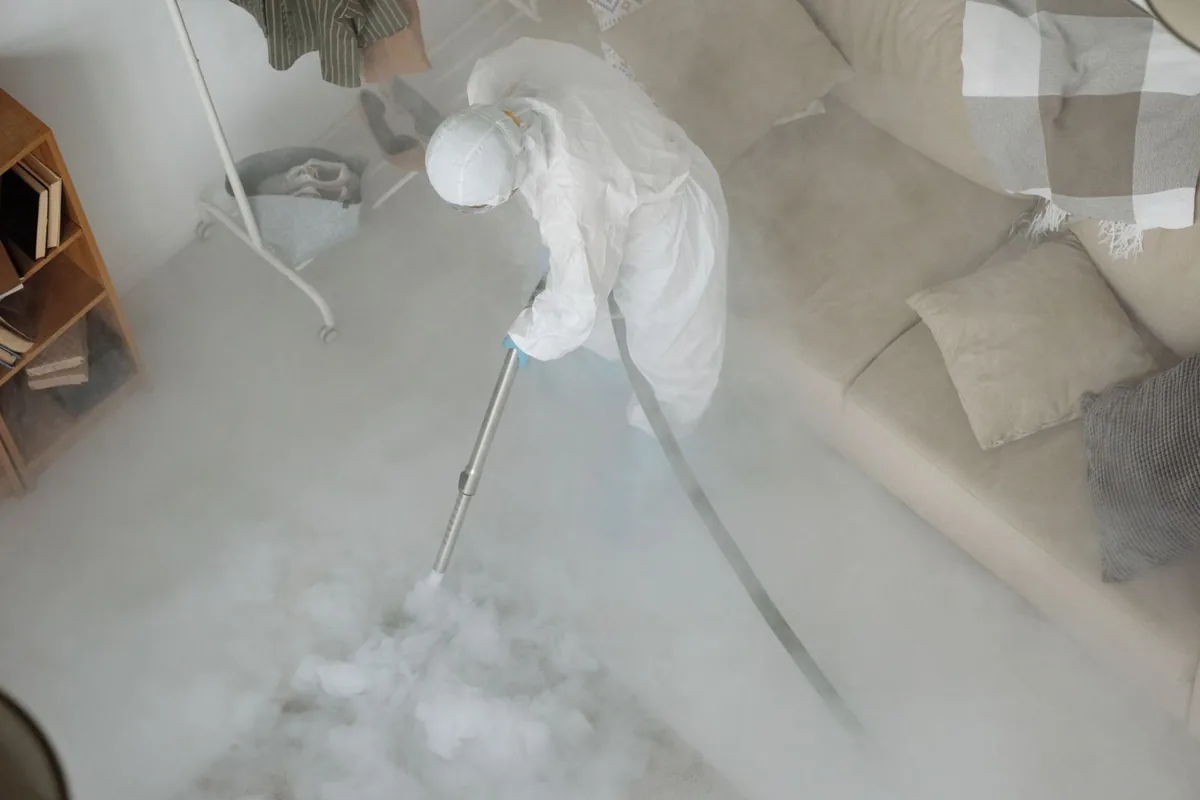 Biohazard cleanup technician in protective equipment, Pray, MT
